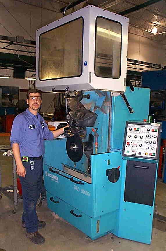 Tom at the CNC cold saw sharpener